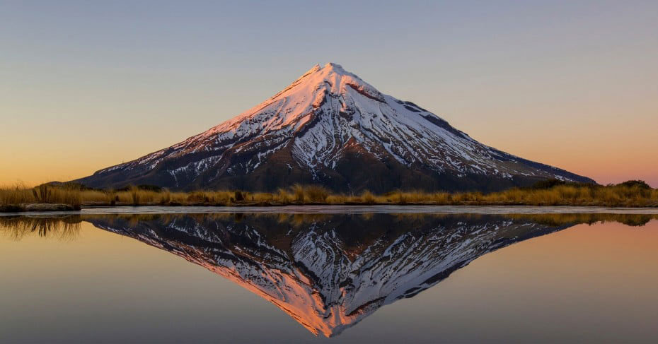 Mt. Taranaki in New Zealand and its reflection over the water