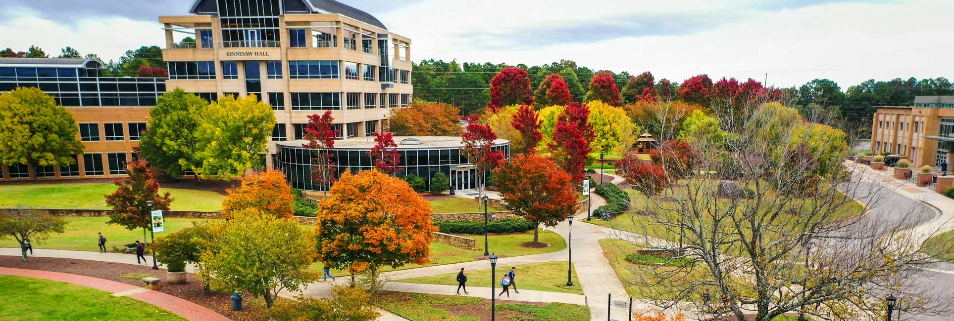 Aerial view of Kennesaw Campus featuring Kennesaw Hall main campus building during the fall