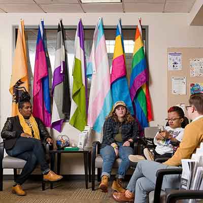 students sitting in the LGBTQ resource center
