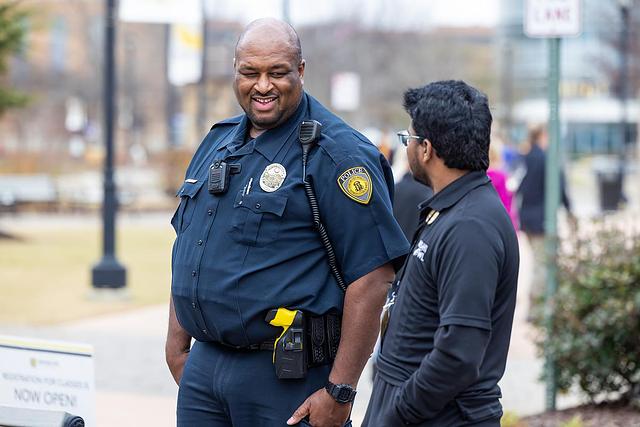 KSU police officer and student having conversation outside