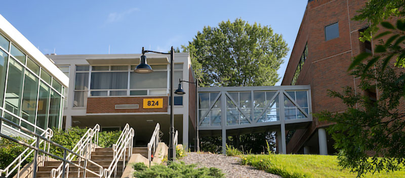 Photo of College of Architecture and Construction Management building with stairs in the forground