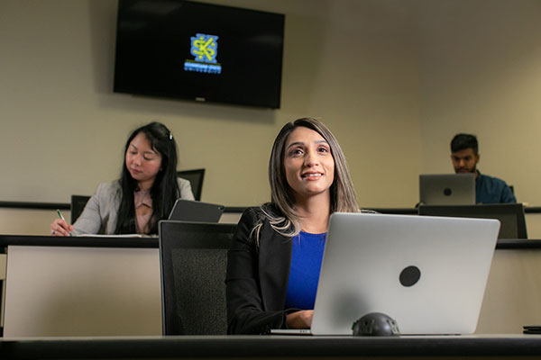 students in class at ksu using laptops