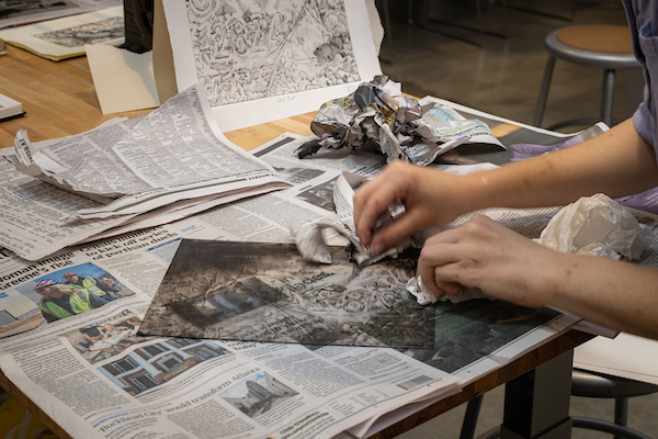 student working on art project
