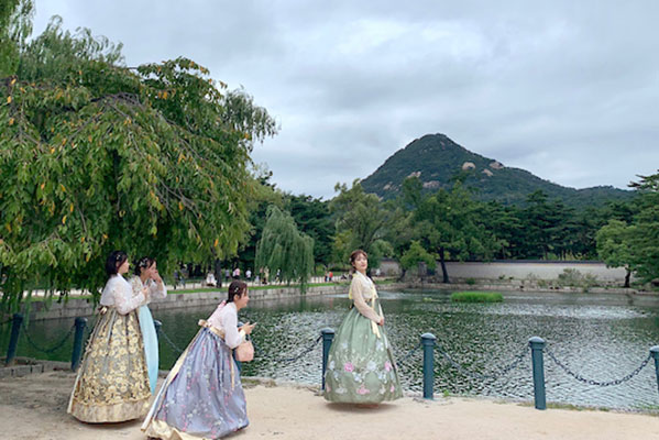 asian women near a pond in asia