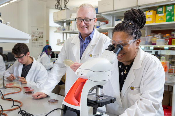 ksu students and professor in biochemisty lab