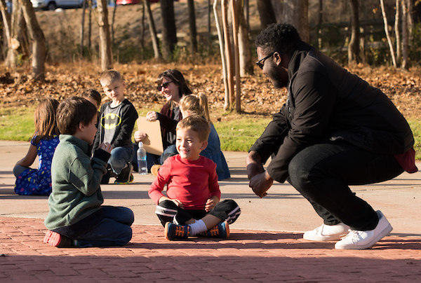 teachers with children at park
