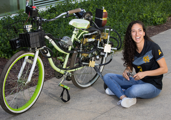 student with environmetally engineered bicycle