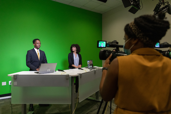 Students in a newsroom