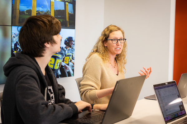 Students and professor in discussion