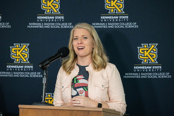 woman speaking at a podium