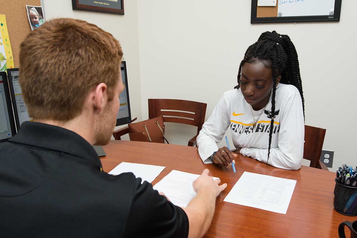 Advisor working with student