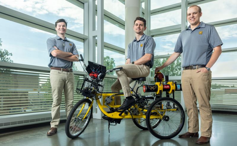 students with environmetally engineered bicycle