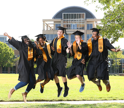 graduation students jumping together