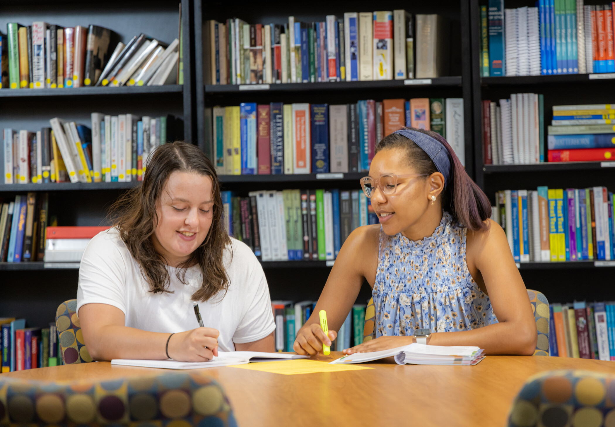 student and tutor in a writing center session