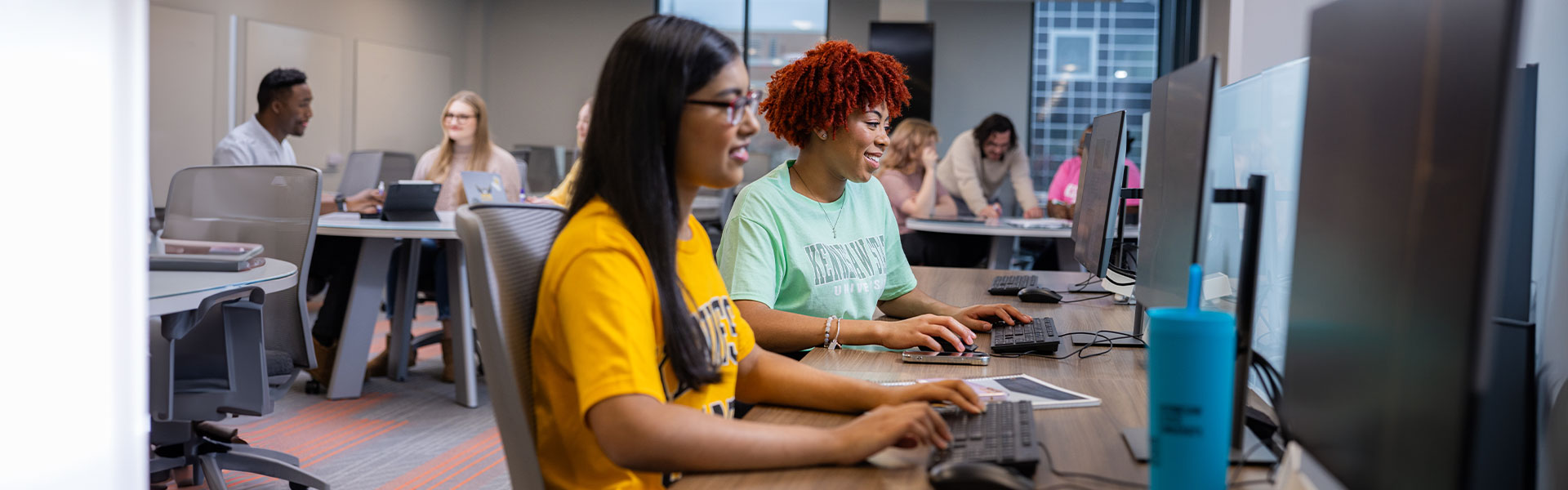 ksu students at the smart center using the computers.