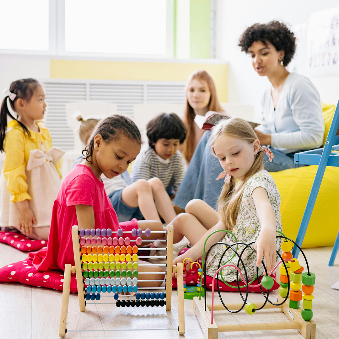 female teacher teaching students