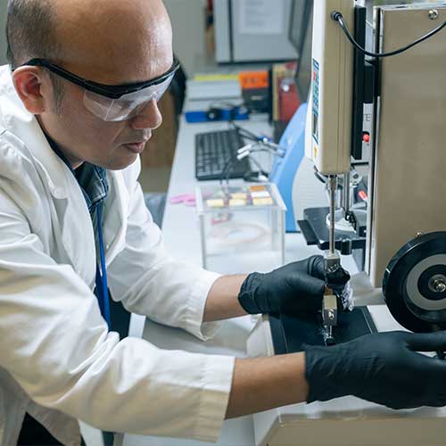 csm student using machine equipment in the lab.
