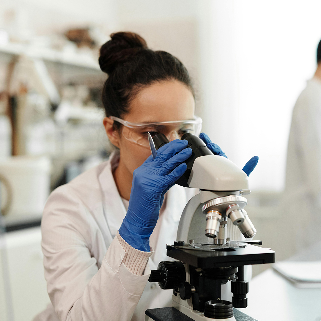close up of female scientist doing research