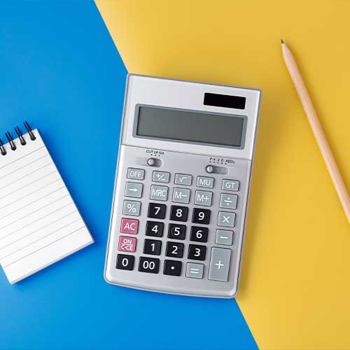 a notepad, pencil, and calculator