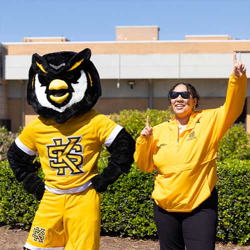 scrappy and a ksu student at the giving day event.