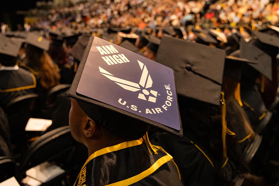 student wearing a u.s air force graduation cap at the ceremony.