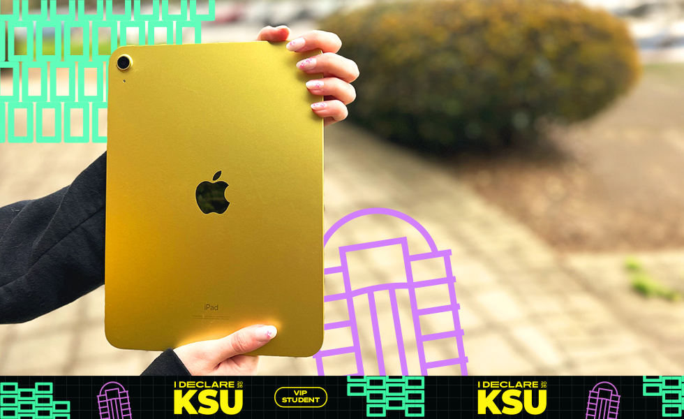 close up on a person holding a yellow ipad with 'i declare ksu' graphics surrounding the photo