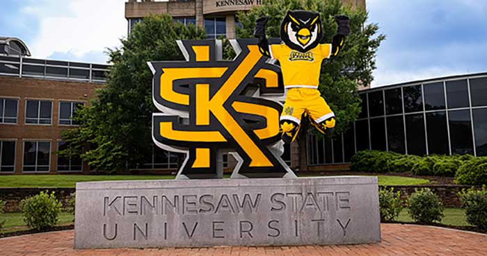 Scrappy Owl jumping off the KSU sign