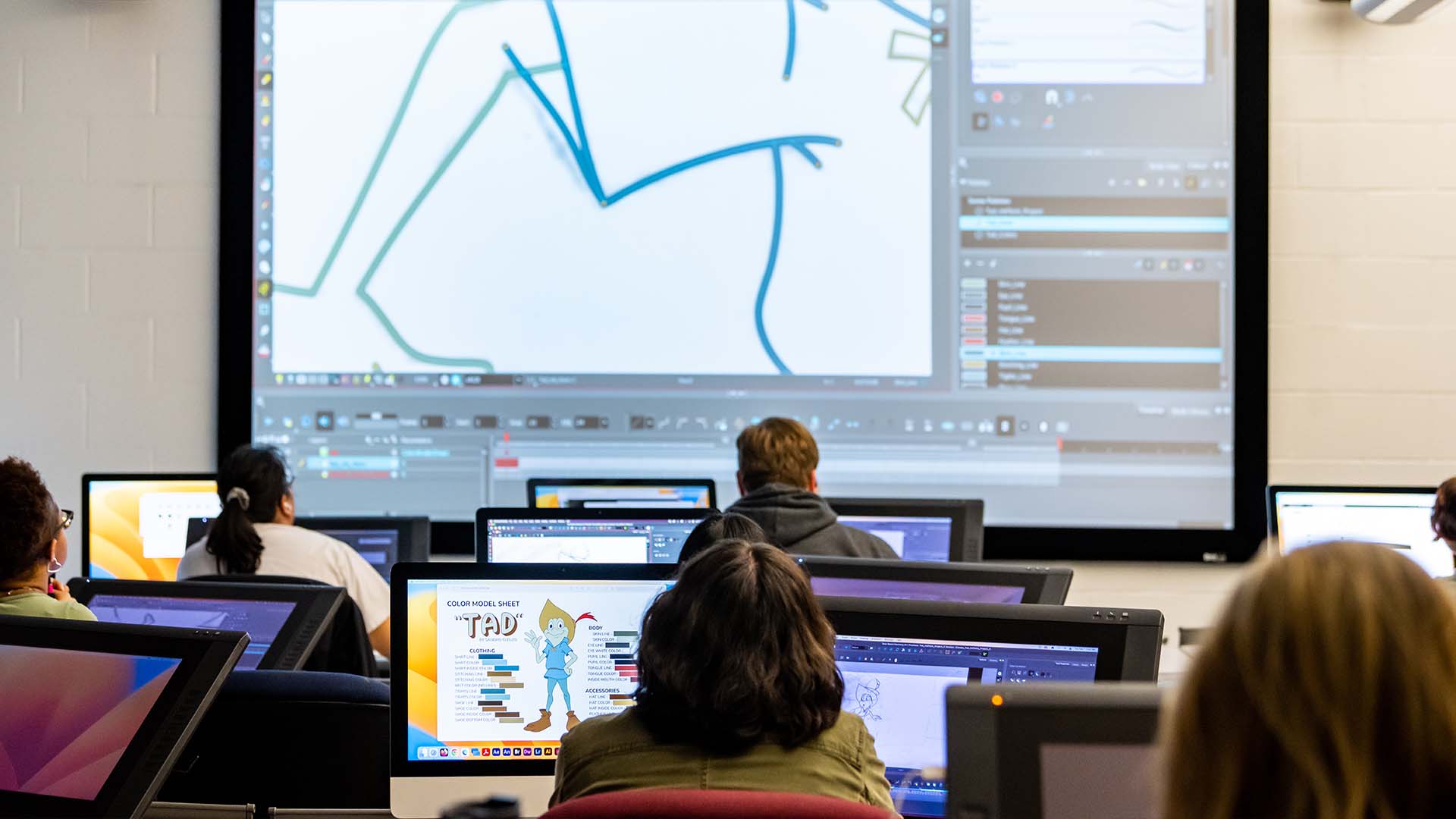  / Animation students listening to lecture in computer lab. 