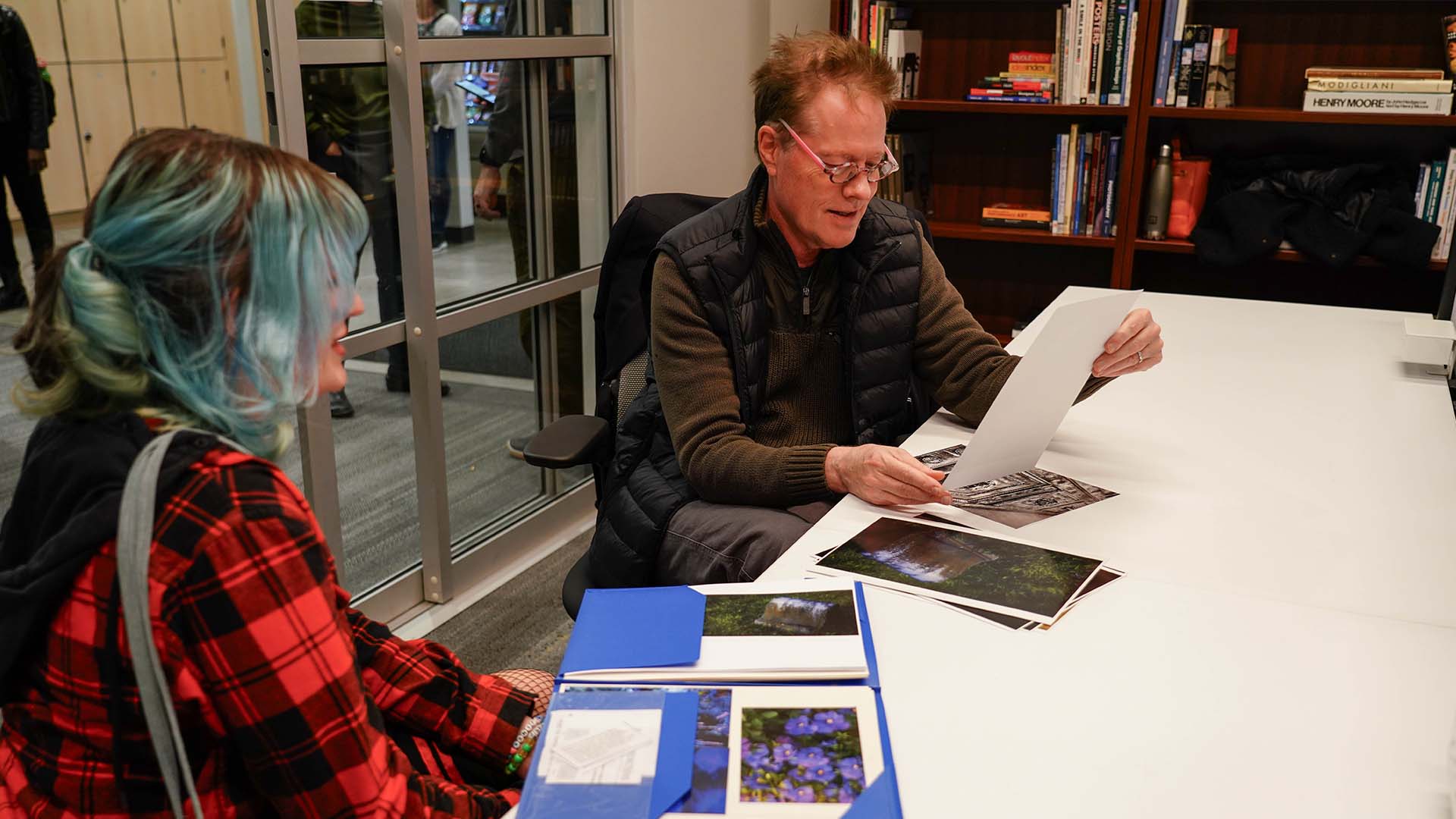  / Director Geo Sipp reviewing a prospective student's portfolio in our work room.