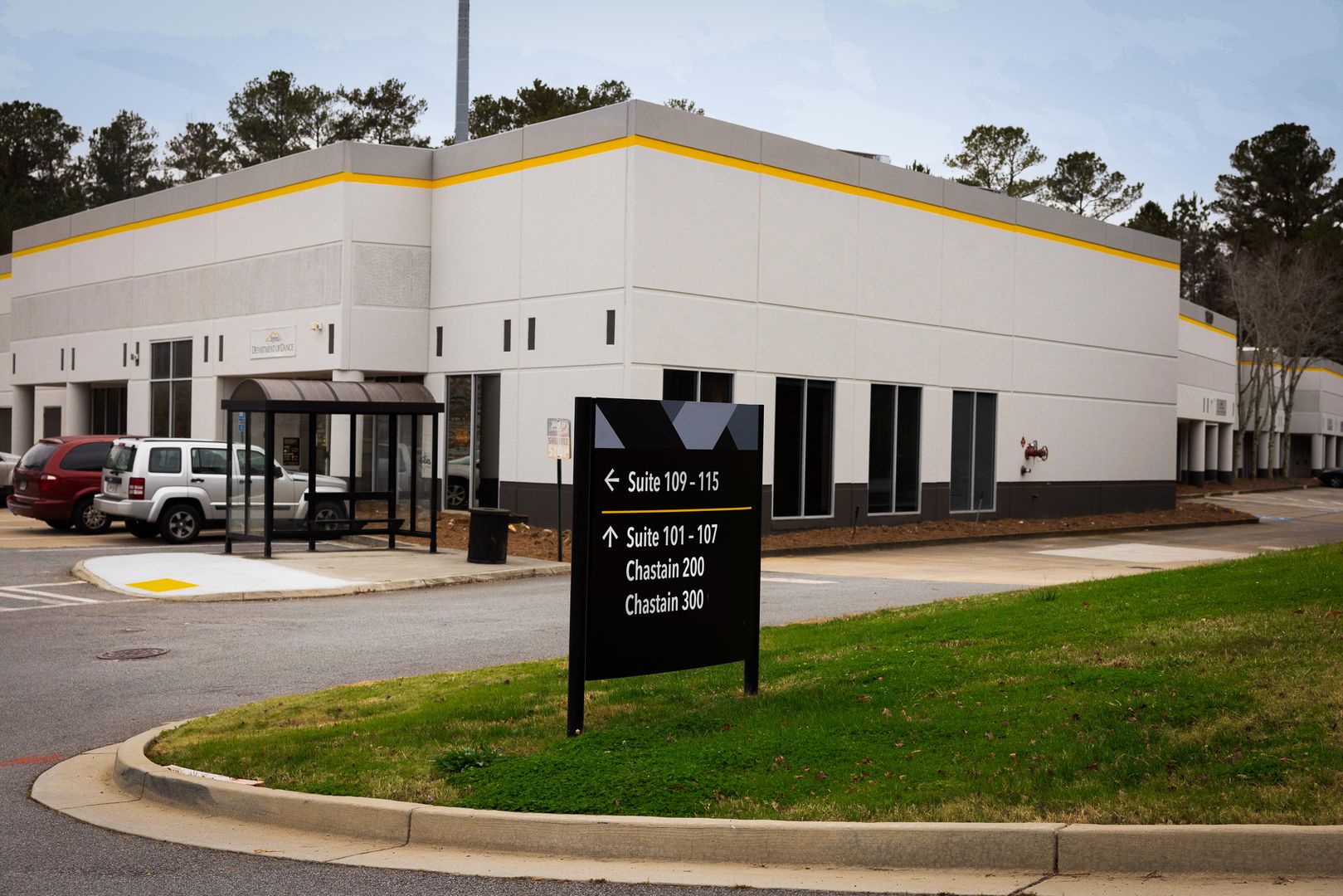  / The exterior of the Chastain Pointe building and signage to direct room numbers