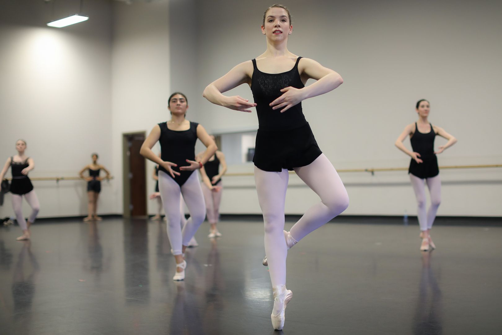  / Ballet students practicing in a large dance studio at Chastain Pointe