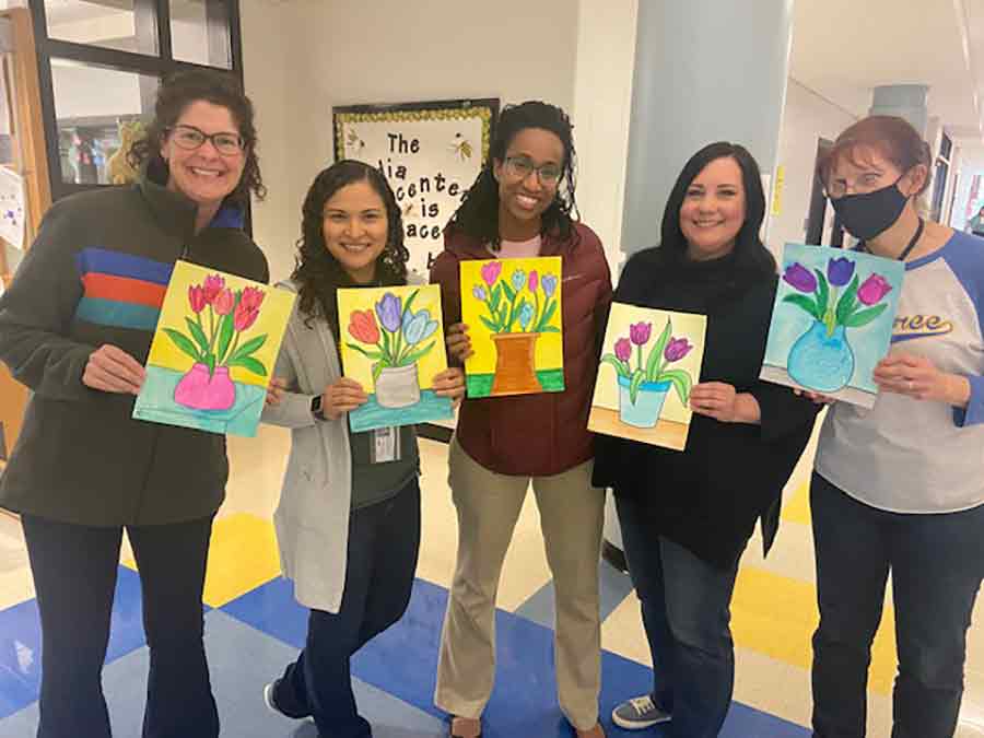 Finished Tulip Drawings / Teachers showcasing their finished tulip drawings painted with watercolors.