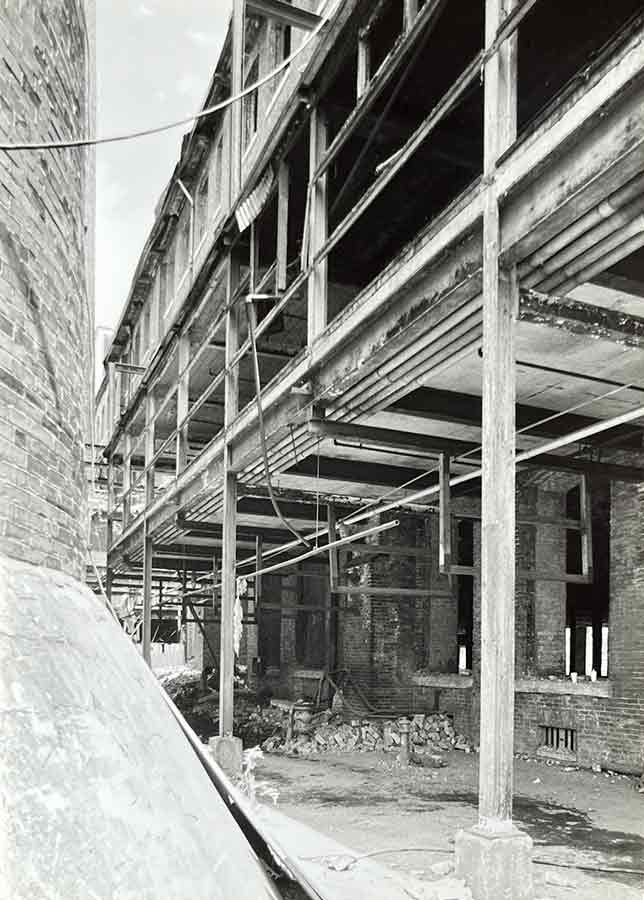 Exterior H Bldg. Condominium Courtyard / Exterior H Bldg. Condominium Courtyard (née Mill Bldg. 1), Smoke Stacks. 1996. Courtesy of Easements Atlanta.