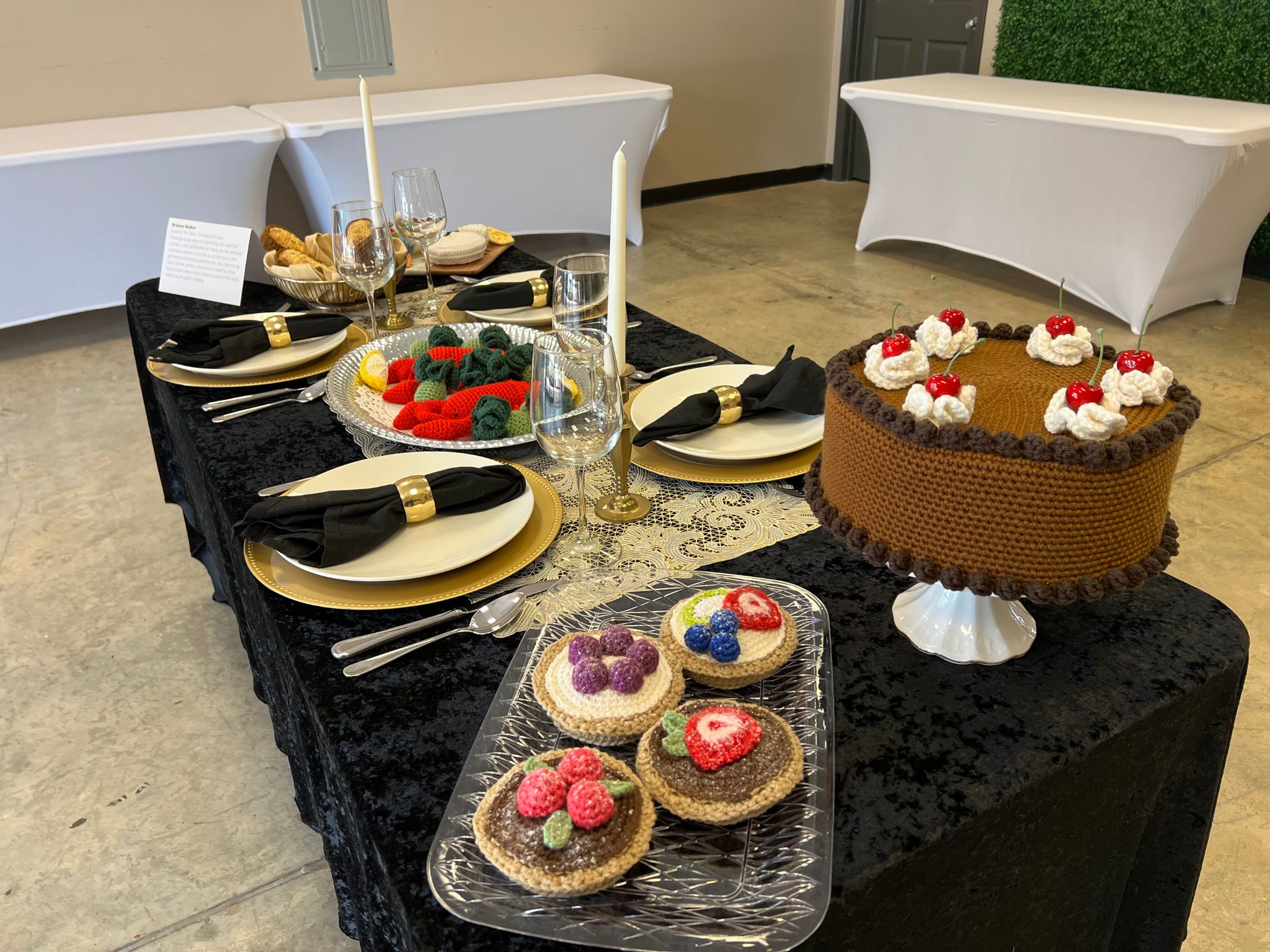 A Seat at the Table / This side of the table shows a closer look into the crocheted desserts created for this piece. Various other materials were used to give these pieces a more realistic appearance - for example, faux cherries, needle felting, and chalk pastel.