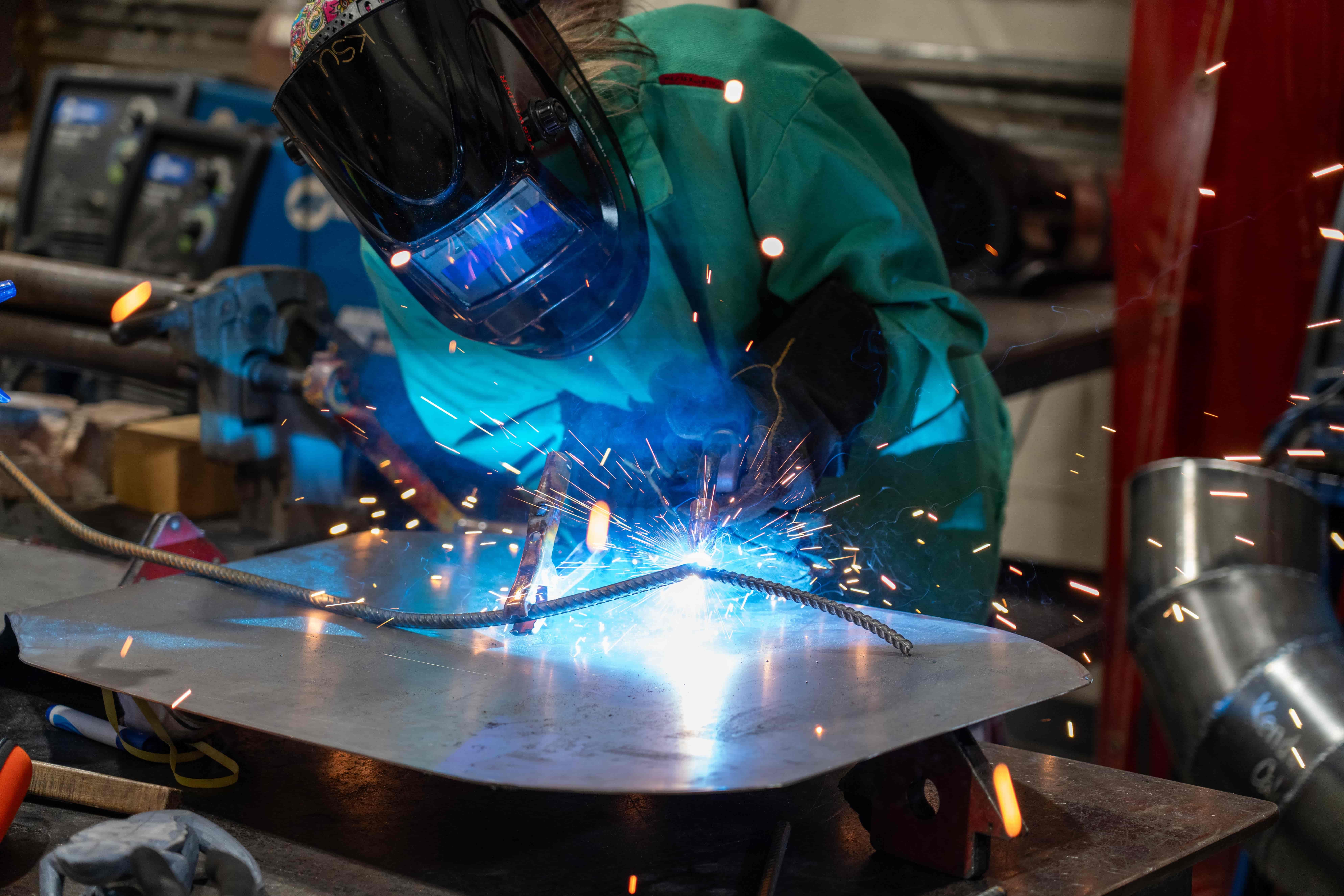 Student Abby Bester welding. / Student Abby Bester welding.