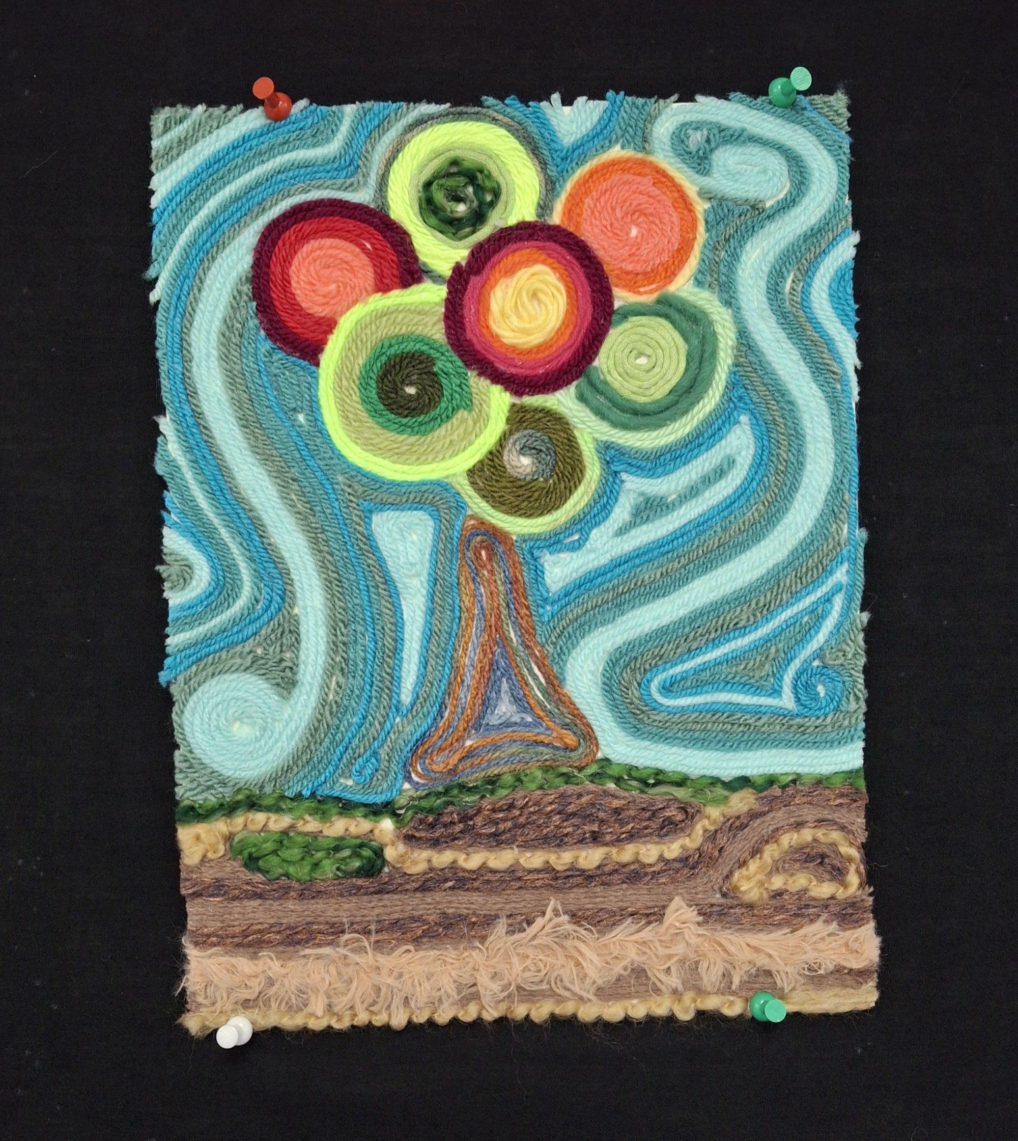 Colorful abstract embroidery of a tree with a swirly background on a black surface. / Yarn painting example for 7th grade project on the Huichol people of Mexico. 