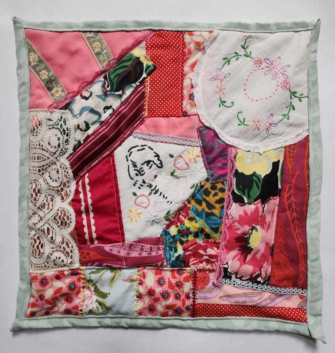  / Driving Me Crazy is a crazy quilt square using vintage fabrics, embroidery, and lace. It was the most challenging to make, hence the name.