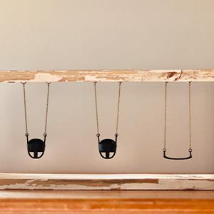  / Boxed Up Dreams (2025). Mixed Media Sculpture: Reclaimed wood, chain, toddler and belt swings designed in Tinkercad and 3D printed 