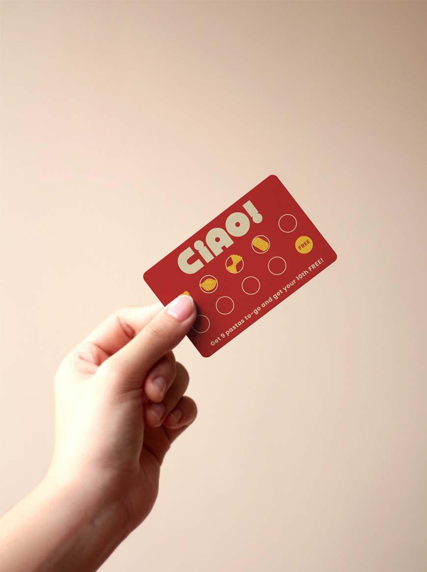  / Red and orange pasta rewards punch card with various noodles in the punch holes.