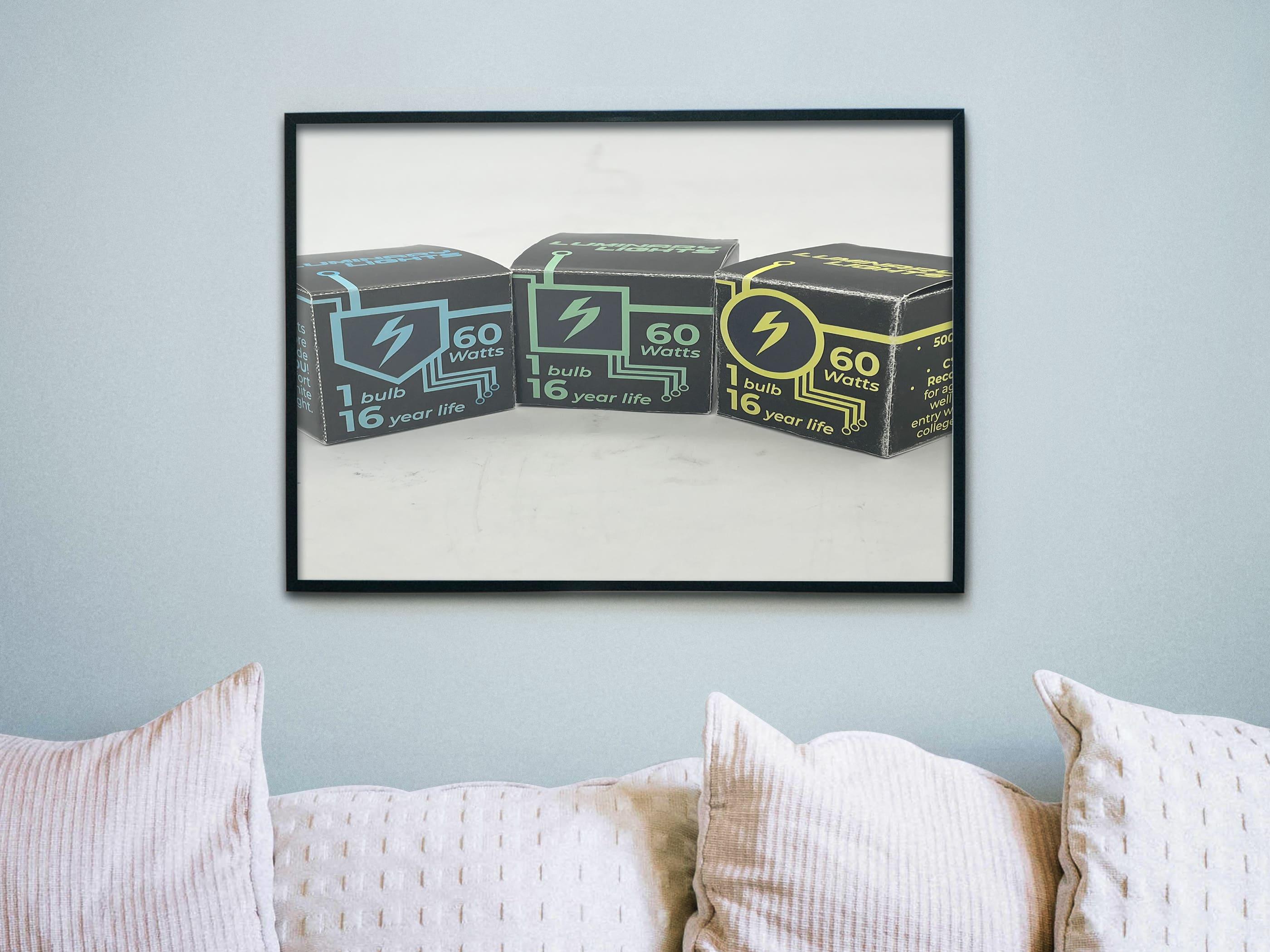  / A photo of a set of cubes that were designed in my Packaging Design class in 2025 to hold small light bulbs within them. The product that would be sold from these are small bulbs called Luminary Lights. 