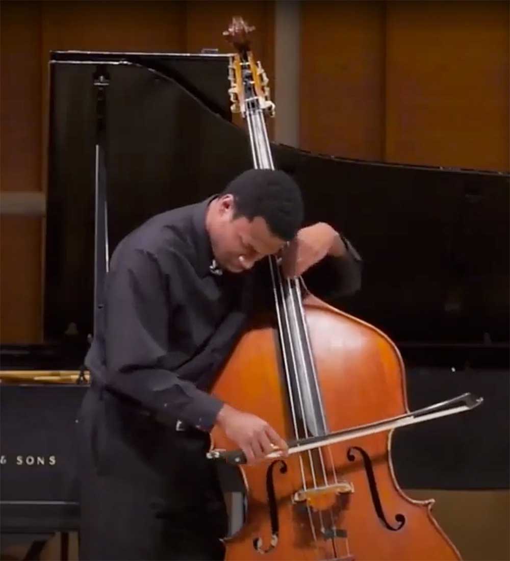 Xavier Foley playing double bass on stage