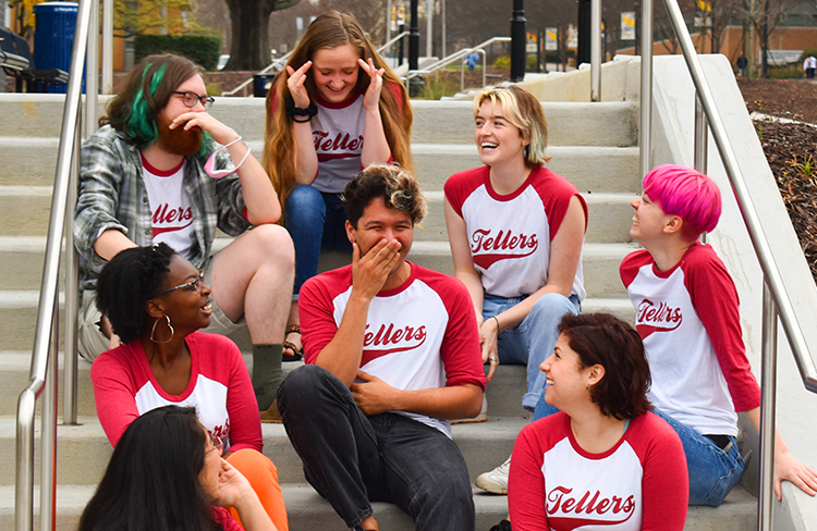 image of students sitting on stairs and laughing