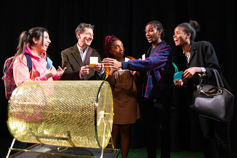 a group of actors on stage performing