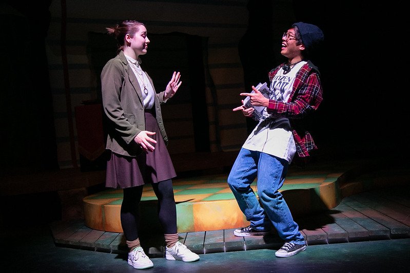 two actors performing on stage