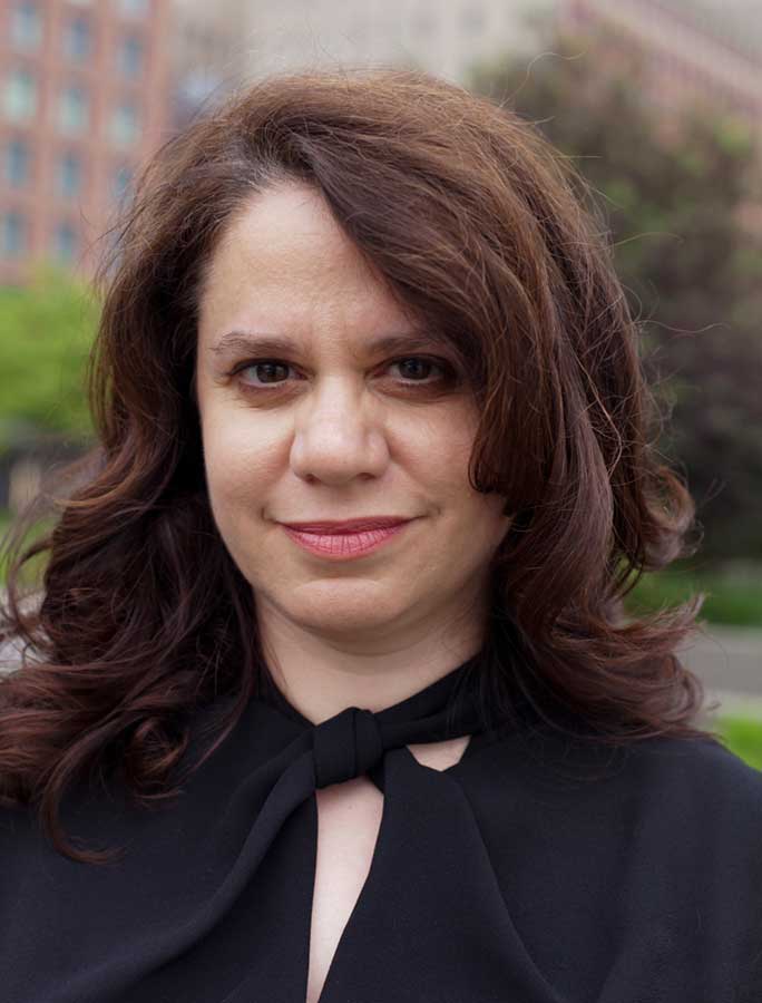 image of Alexandra Schwartz standing in front of building