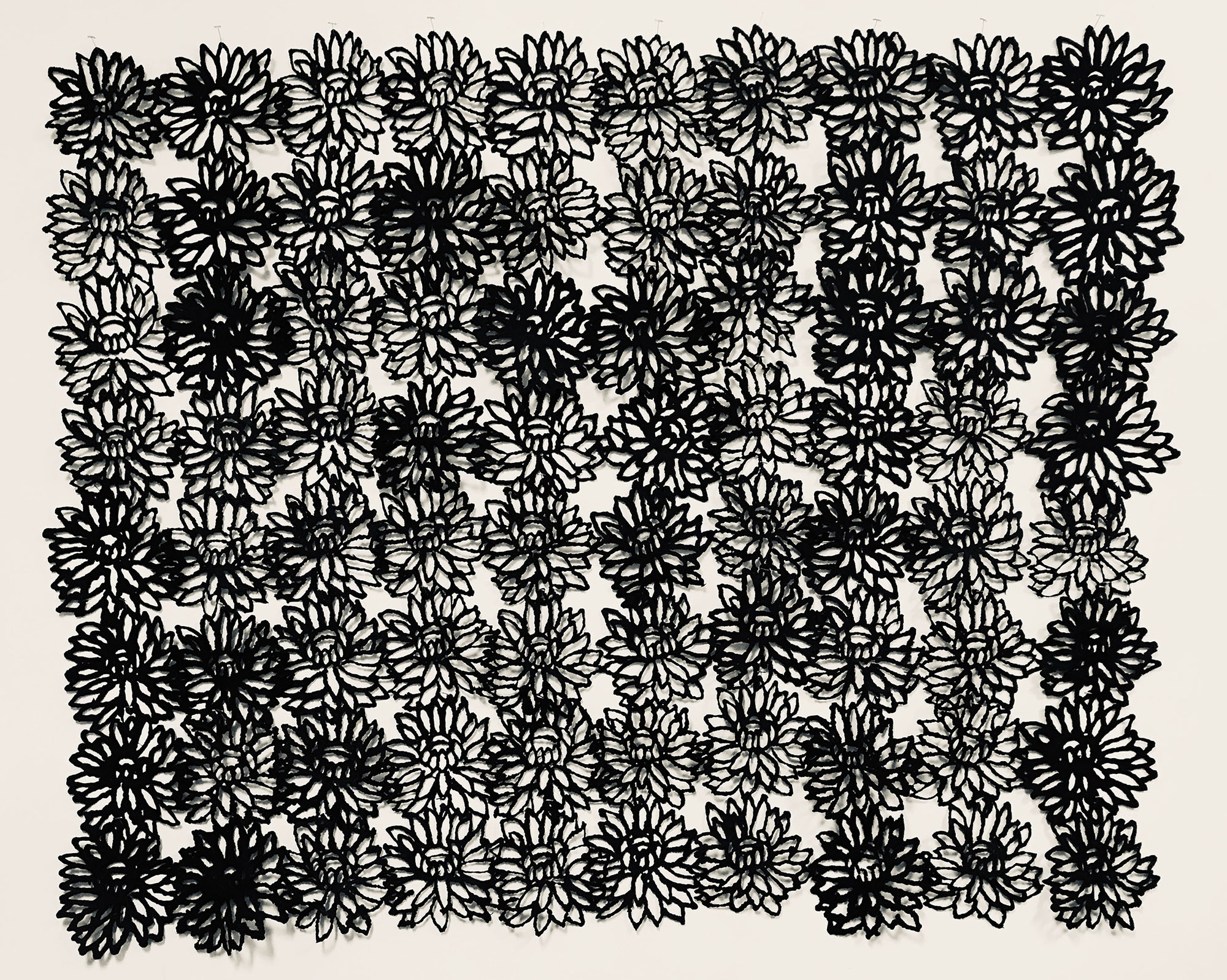 black flower pattern on white background