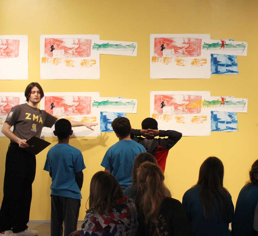 Image of Zuckerman Museum of Art Docent leading tour in the gallery to young students