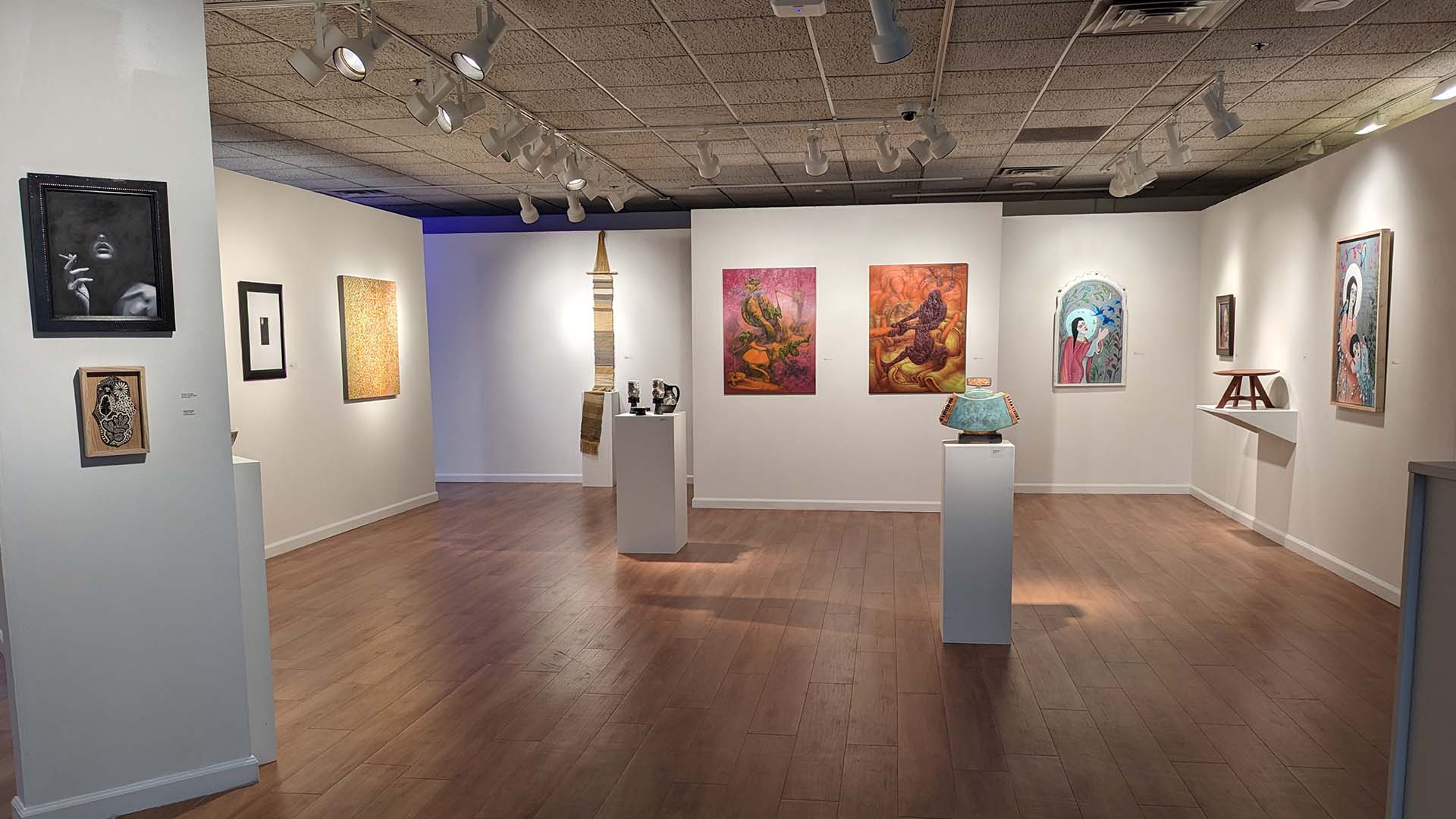 installation shot of the alumni biennial in fine arts gallery