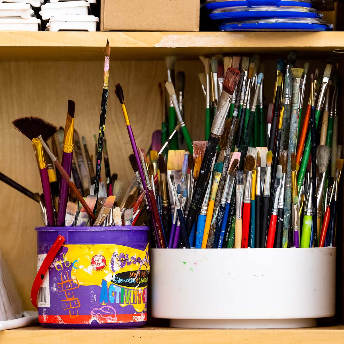 pot full of paint brushes