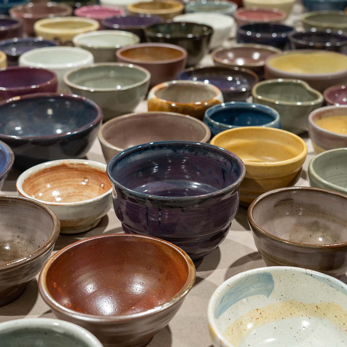 bunch of colorful bowls on a table